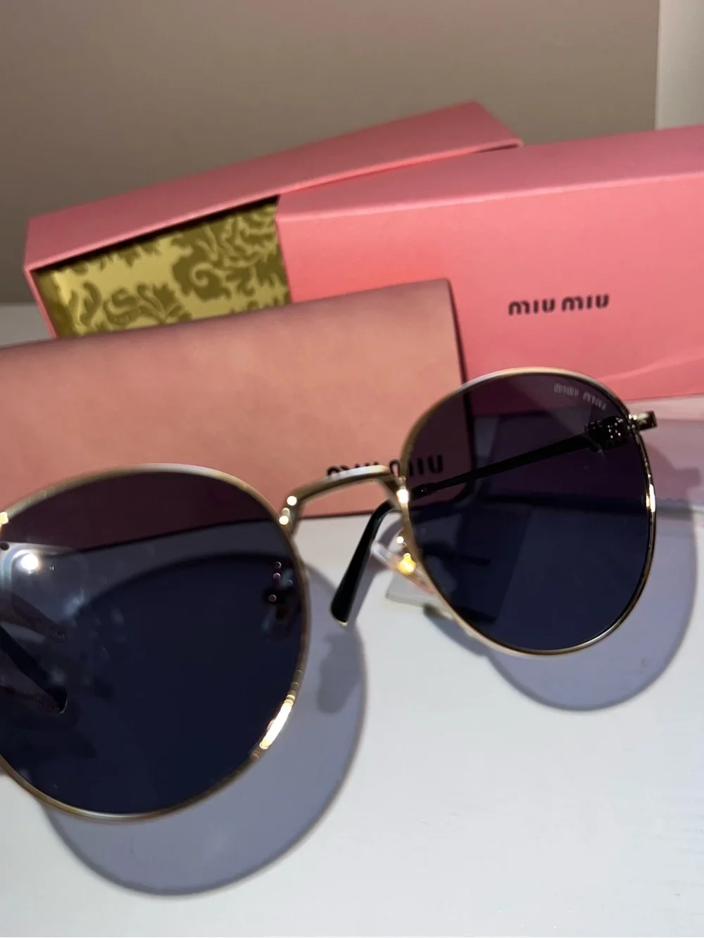 Miu Miu Gold Metal Round Sunglasses with Black Lenses